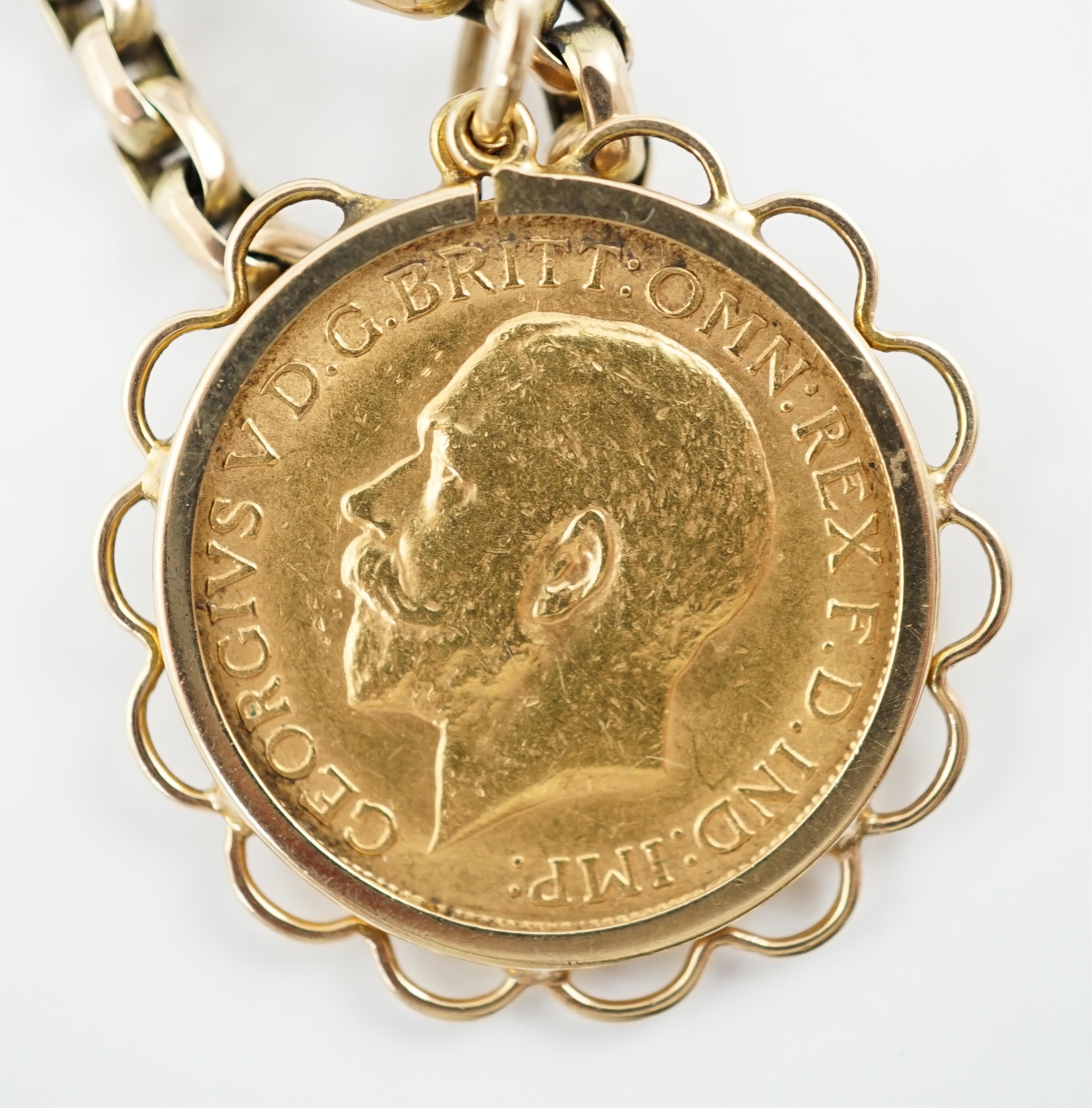 A George V gold sovereign, in a later 9ct gold pendant mount, on a 9ct chain